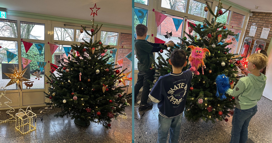 Kinder schmücken den Weihnachtsbaum im Eingangsbereich der Schule